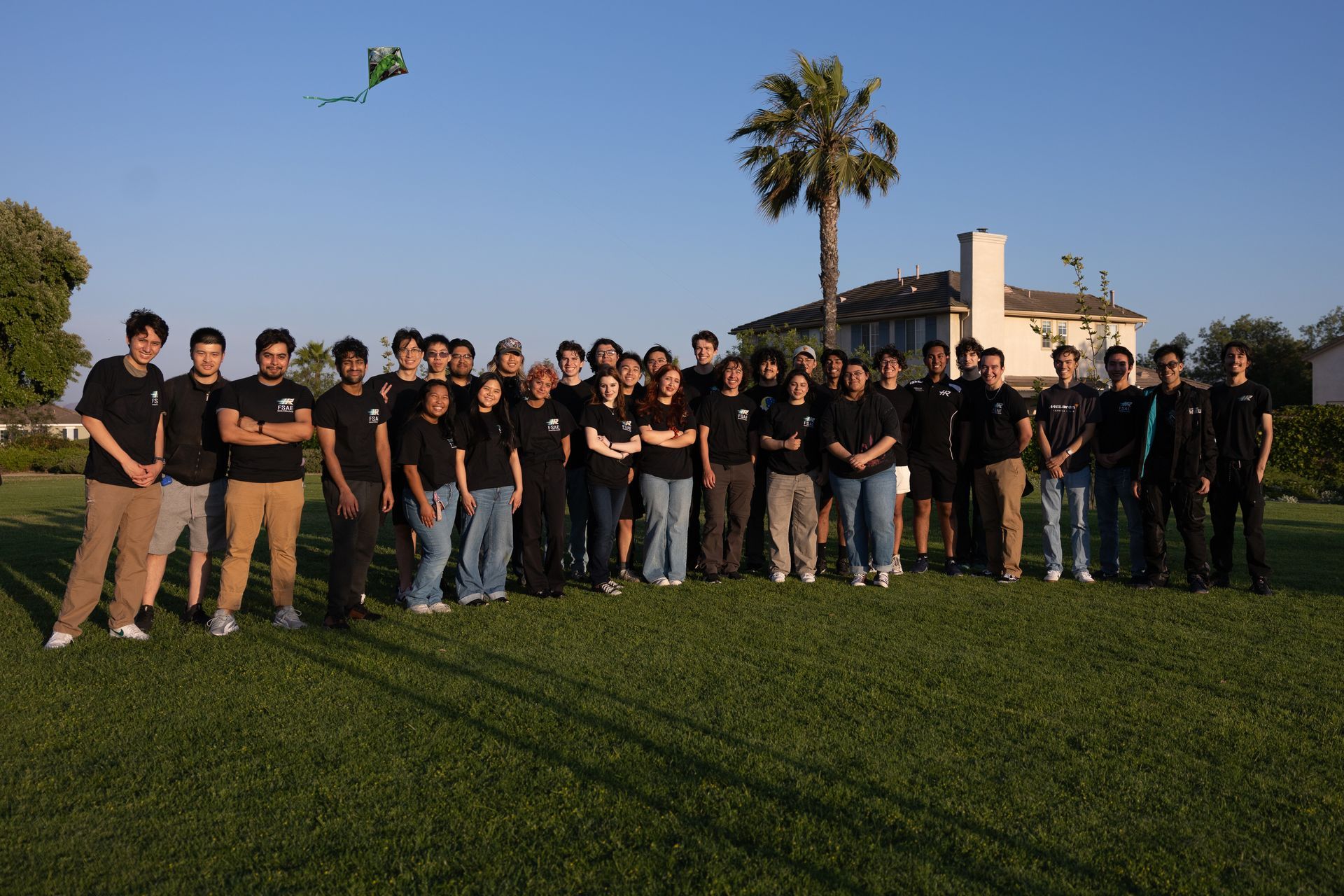 Highlander Racing students gathered with their race car on the UCR campus
