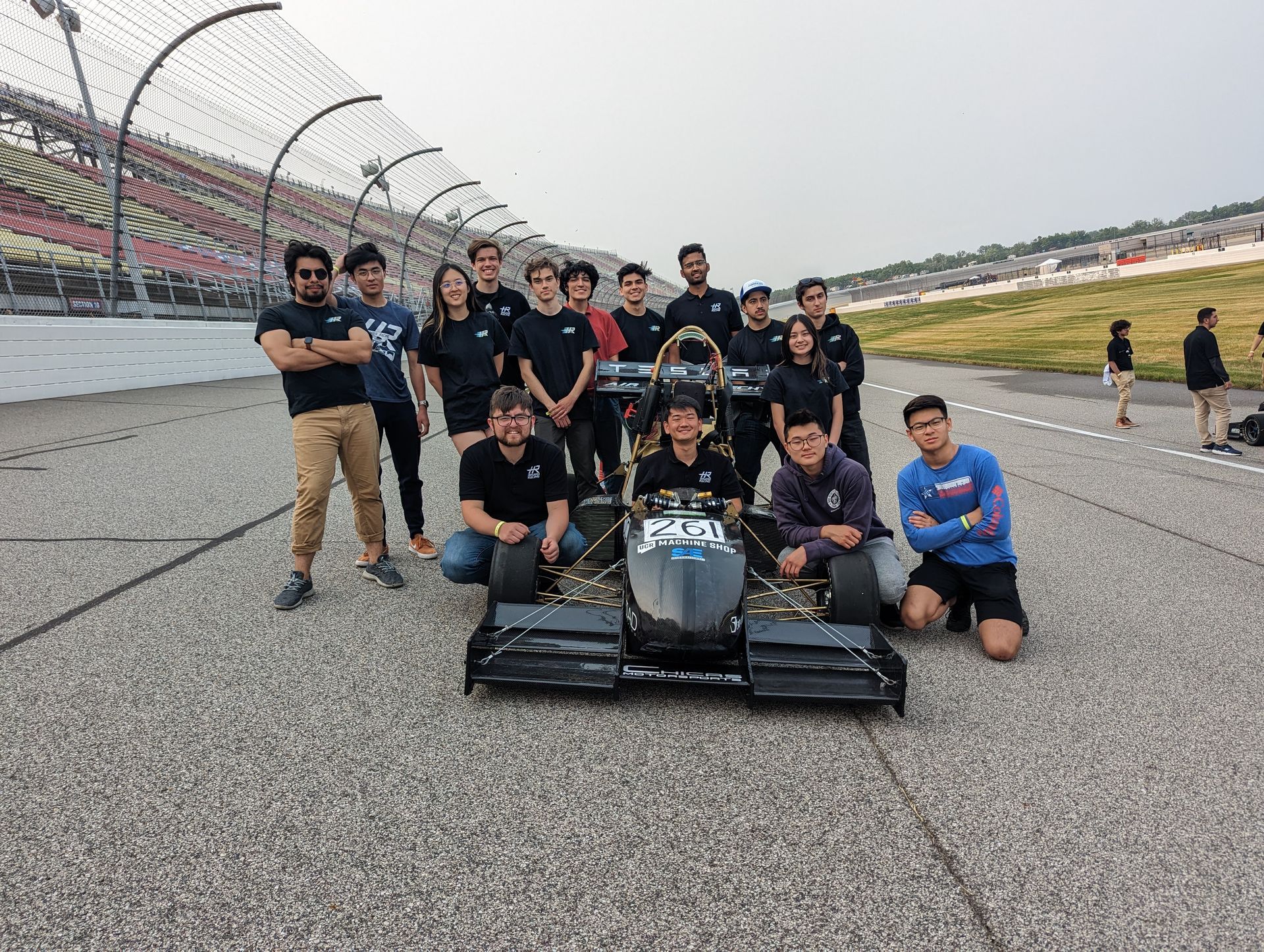 Highlander Racing team with their electric car at Formula SAE